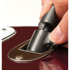 A close-up of a hand pressing a black handle onto a metallic car door lock or latch mechanism, set against a dark red vehicle surface.