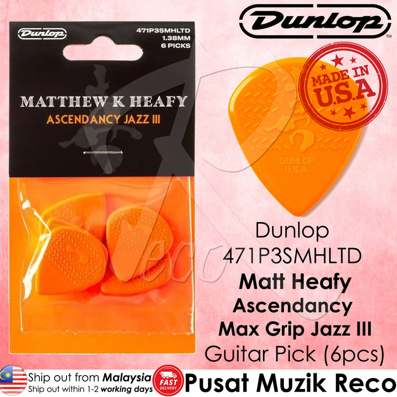 Dunlop guitar pick packaging with orange picks and 'Made in USA' stamp on a pink background