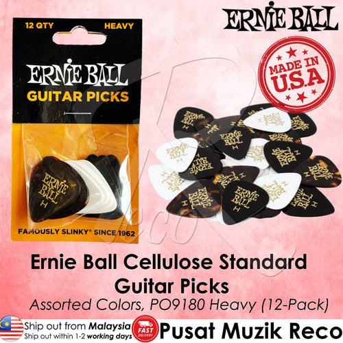Ernie Ball heavy guitar picks in assorted black, white, and tortoiseshell colors, shown in their original retail packaging alongside a pile of loose picks on a pink background with product text and branding.