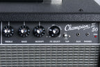 Close-up of a Champion II 50 guitar amplifier with control knobs and labels.