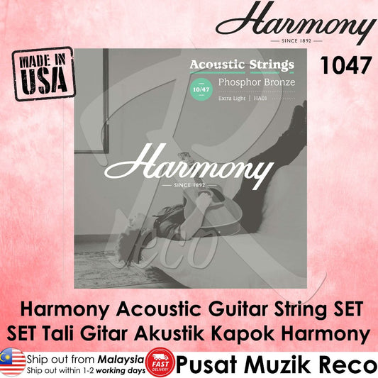 Promotional graphic for a Harmony brand acoustic guitar string set, featuring a grayscale product image of a guitar with strings on a bench, surrounded by pink textured borders, text overlays in English and Malay, and a 'Made in USA' badge.