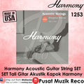 Promotional graphic for Harmony Acoustic Guitar Strings Set 1253 Phosphor Bronze, featuring a grayscale product cover image of a person holding a guitar, set against a pink textured background with 'MADE IN USA' and distributor text.