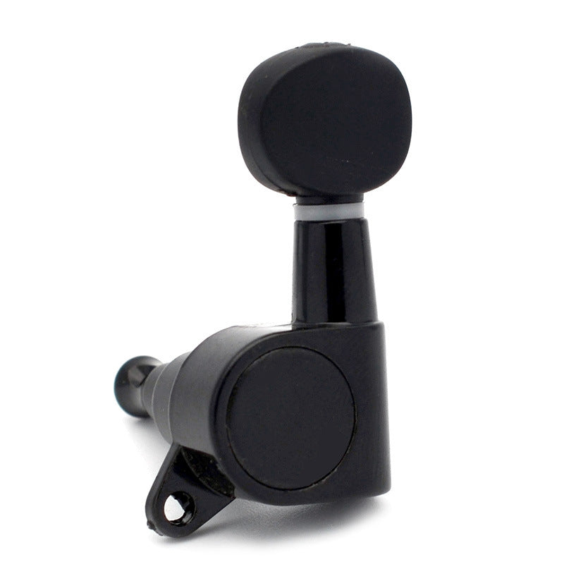 A single black guitar tuning peg with a matching black rubberized grip on the wheel, shown on a clean white background.