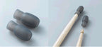 Drum mallets with wooden handles and gray rubber heads on a light gray background